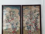 two framed paintings of a man riding a horse and a woman riding a horse