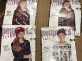 Quatre affiches des Girls' Generation sont exposées dans un caddie