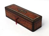 a small wooden box that is sitting on a white surface