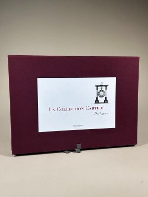 purple picture frame with a clock on top of it on a table