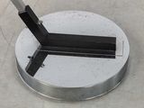 an image of a metal object with a knife in it