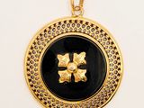 an image of a black and gold locke with a cross on it
