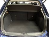 a trunk of a blue car with its doors open