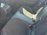 the interior of a car with black leather seats and black trims