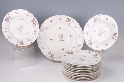 a lot of plates that are sitting on a table