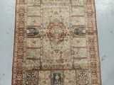 a beige and red rug on a white floor