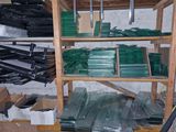 a room with a shelf full of green plastic items