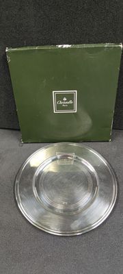 an image of a silver plate with a green box in the background