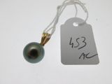 a small black pearl on a string with a price tag