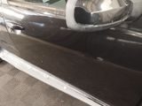 a close up of a car door with a mirror on it