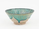 turquoise and white ceramic bowl on a white background