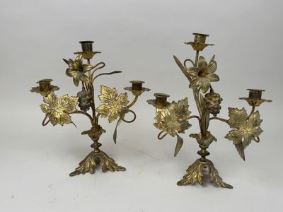 pair of antique brass candelabs with flowers and leaves