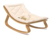 a white rocking chair with a white cushion on it