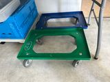 a green and blue cart next to a blue and white cart