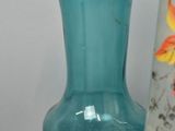 two vases sitting next to each other on a table