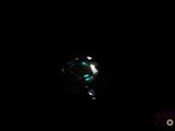an image of a ring in the dark with a green glow