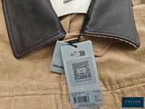 a label on the back of a jacket that is attached to a jacket