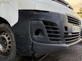a white van that is parked on the side of the road