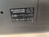 a close up of a laptop with a bar code on it