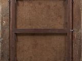 an old wooden frame with a window on a wall