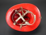 an image of a red hard hat with a strap around the brim
