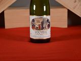 a bottle of wine that is sitting on a table