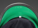 a close up of a person ' s hat with a label on it