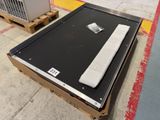 a box with a remote control sitting on top of it