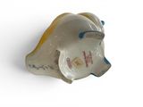 porcelain figurine of a woman ' s head on a white surface