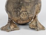 an image of a silver vase with a face on it