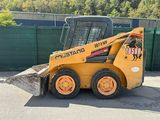 a picture of a ski - loader parked in a parking lot