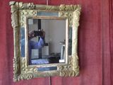 a man taking a picture of himself in a mirror