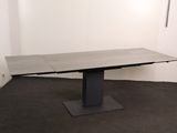 an image of a table in a room with a black base