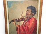 tableau représentant un homme jouant du violon, dans un cadre doré