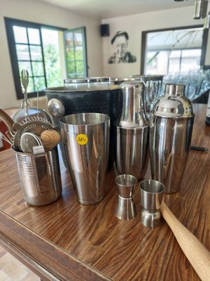 many different types of kitchen utensils on the counter
