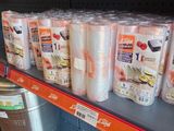 many rolls of toilet paper on the shelves in the store