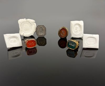 three different types of rings on a reflective surface