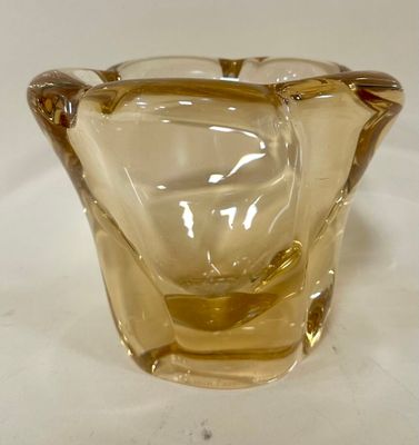 a glass vase that is sitting on a table