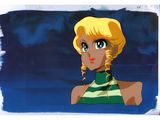 an image of a woman with blonde hair and a green and white striped shirt