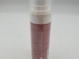 an image of a bottle of lotion sitting on a table