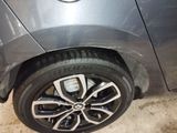 a close up of a car ' s tire on the ground