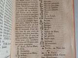 a book open to a page of text on a table