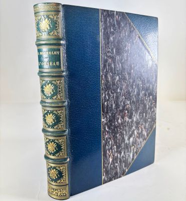 a close up of a book on a table with a white background