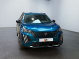the front of a blue car is parked in a showroom