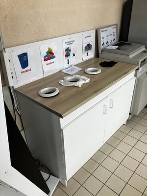 a small kitchen with a refrigerator, stove, microwave, and dishwasher