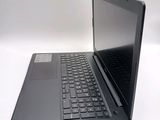 a laptop computer sitting on top of a white table