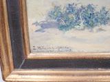 a painting of a bunch of flowers in a gold frame