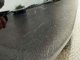 a close up of a person ' s hand on the side of a car