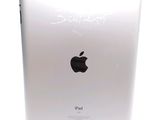 a white ipad with a writing on the back of it