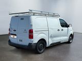 a white van that is parked in a room